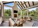 Inviting covered porch features a fireplace, comfortable seating, and scenic views of the surrounding greenery at 3773 Randall Se Rd, Atlanta, GA 30339