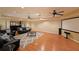 Finished basement with a projector screen, hardwood floors, and a wet bar at 5617 Asheforde Ln, Marietta, GA 30068