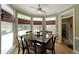 Sunlit breakfast nook with large windows providing views of the backyard and pool area at 5617 Asheforde Ln, Marietta, GA 30068