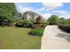 Well-manicured lawn and landscaping surround this inviting two-story home at 5617 Asheforde Ln, Marietta, GA 30068