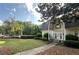 Traditional-style home with well-manicured lawn and mature trees offers curb appeal at 5617 Asheforde Ln, Marietta, GA 30068