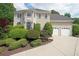 Charming two-story home with manicured landscaping and attached two-car garage at 5617 Asheforde Ln, Marietta, GA 30068