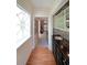 Hallway featuring wet bar, elegant tile backsplash and a view through an arched doorway at 5617 Asheforde Ln, Marietta, GA 30068