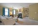 Cozy living room featuring a fireplace, built-in shelving, and comfortable seating at 5617 Asheforde Ln, Marietta, GA 30068