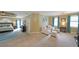 Spacious main bedroom with sitting area and neutral color scheme at 5617 Asheforde Ln, Marietta, GA 30068