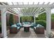 Outdoor patio lounge area with fire pit and comfortable seating at 5617 Asheforde Ln, Marietta, GA 30068