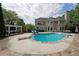 Backyard swimming pool with diving board, lounge area, and landscaped surroundings at 5617 Asheforde Ln, Marietta, GA 30068