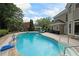 Backyard pool and patio area is great for entertaining or enjoying the sun at 5617 Asheforde Ln, Marietta, GA 30068