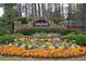 Community sign with stone base and flower bed in this neighborhood at 5617 Asheforde Ln, Marietta, GA 30068
