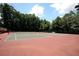 Community tennis courts with well maintained surface at 5617 Asheforde Ln, Marietta, GA 30068