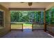 Charming back porch with scenic views of the lush backyard at 1406 Windy Ridge Se Ct, Conyers, GA 30013