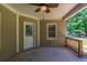 Cozy back porch featuring a ceiling fan and railing, offering a relaxing outdoor space at 1406 Windy Ridge Se Ct, Conyers, GA 30013