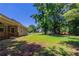 Spacious backyard with mature trees providing shade, enhancing the outdoor living experience at 1406 Windy Ridge Se Ct, Conyers, GA 30013