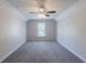 Large bedroom with carpet flooring and natural light at 1406 Windy Ridge Se Ct, Conyers, GA 30013