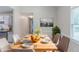 Staged dining room with dining table, chairs, and natural light at 1406 Windy Ridge Se Ct, Conyers, GA 30013