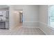 Open dining room with views to the kitchen and backyard at 1406 Windy Ridge Se Ct, Conyers, GA 30013