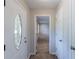 Bright foyer with decorative glass front door and tiled flooring at 1406 Windy Ridge Se Ct, Conyers, GA 30013