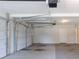 A well-lit garage with ample space, featuring a new garage door and convenient access to the house at 1406 Windy Ridge Se Ct, Conyers, GA 30013