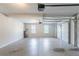Spacious garage with high ceilings, garage door opener, and two windows for natural light at 1406 Windy Ridge Se Ct, Conyers, GA 30013