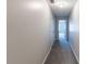 Neutral hallway with carpet flooring and white doors at 1406 Windy Ridge Se Ct, Conyers, GA 30013
