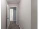 Hallway featuring carpet flooring and a white interior door at 1406 Windy Ridge Se Ct, Conyers, GA 30013