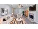 Stylishly furnished living room featuring hardwood floors, fireplace and natural light at 1406 Windy Ridge Se Ct, Conyers, GA 30013