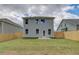 Backyard with a newly installed wooden fence and lush green grass at 19 Camellia Dr, Fairburn, GA 30213