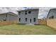 Backyard featuring a privacy fence, lawn and view of the home's exterior at 19 Camellia Dr, Fairburn, GA 30213