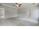 Large bedroom showing plush carpet, a modern ceiling fan, and neutral paint at 19 Camellia Dr, Fairburn, GA 30213
