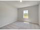 Carpeted bedroom featuring a window and neutral paint at 19 Camellia Dr, Fairburn, GA 30213