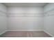 Walk-in closet with carpet and wire shelving for organized storage at 19 Camellia Dr, Fairburn, GA 30213