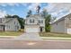 Charming two-story home featuring a brick-accented garage and complementary light-gray siding at 19 Camellia Dr, Fairburn, GA 30213