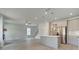 Open-concept kitchen with stainless steel appliances, large island, and hardwood floors at 19 Camellia Dr, Fairburn, GA 30213