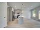 Modern kitchen with gray cabinets, stainless steel appliances, and a center island, offering ample counter space at 19 Camellia Dr, Fairburn, GA 30213
