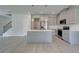 Eat-in kitchen featuring stainless appliances, stylish pendant lights, and gray cabinetry at 19 Camellia Dr, Fairburn, GA 30213