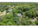 An aerial view of the house surrounded by a vibrant canopy of mature trees at 311 Rolling Rock Se Rd, Marietta, GA 30067