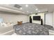 Basement entertainment area, with flat screen, play area, and neutral carpet at 311 Rolling Rock Se Rd, Marietta, GA 30067