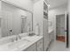 A bathroom with white cabinets, and a large mirror at 311 Rolling Rock Se Rd, Marietta, GA 30067