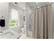 Bright bathroom with a shower and a window at 311 Rolling Rock Se Rd, Marietta, GA 30067