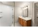 Modern bathroom with glass shower and light wood vanity at 311 Rolling Rock Se Rd, Marietta, GA 30067
