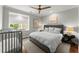 Modern bedroom with an upholstered bed and a wooden crib at 311 Rolling Rock Se Rd, Marietta, GA 30067