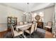 Bright dining room with chandelier, decorative rug and built-in china cabinet at 311 Rolling Rock Se Rd, Marietta, GA 30067