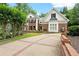 Beautiful brick home with manicured landscaping and a long driveway at 311 Rolling Rock Se Rd, Marietta, GA 30067