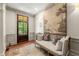 Cozy foyer with bench seating, elegant wall decor, and hardwood flooring at 311 Rolling Rock Se Rd, Marietta, GA 30067