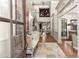 Bright foyer with hardwood floors, a bench, and a view of the staircase leading to the upper level at 311 Rolling Rock Se Rd, Marietta, GA 30067