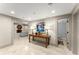 Finished basement hallway with a table, lamps, and views into an open living space at 311 Rolling Rock Se Rd, Marietta, GA 30067