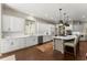 Bright kitchen with white cabinetry, stainless steel appliances, and a center island with seating at 311 Rolling Rock Se Rd, Marietta, GA 30067