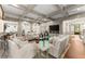Open living room featuring coffered ceilings, hardwood floors, neutral colors, and plenty of seating at 311 Rolling Rock Se Rd, Marietta, GA 30067