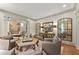 Sophisticated living room with hardwood floors, recessed lighting and neutral color palette at 311 Rolling Rock Se Rd, Marietta, GA 30067