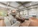 Spacious living room with coffered ceilings, fireplace, hardwood floors, and open to the kitchen at 311 Rolling Rock Se Rd, Marietta, GA 30067